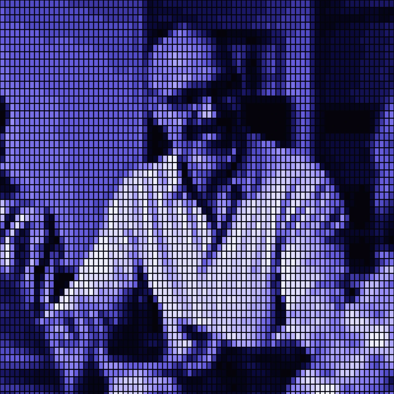 An operator smiling across the table in a meeting.